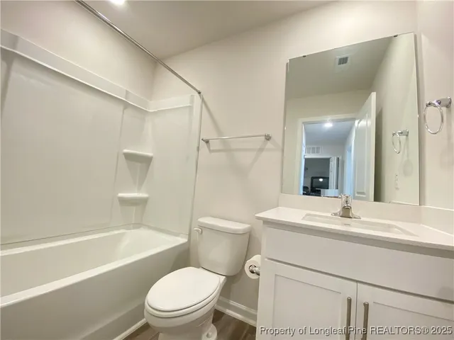 a bathroom with a sink a toilet and a bathtub
