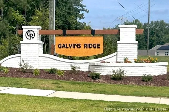 a sign board with an ocean view