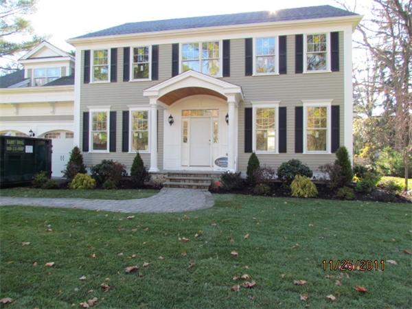 2 Mayo Road Wellesley, MA 02482 - Photo 1 of 9 a front view of a house with a garden