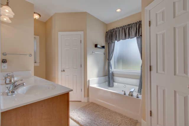439 Conquest Road Murfreesboro, TN 37128 - Photo 14 of 20 Double sink vanity. Seperate tub and shower. Garden tub with large picture window. The master bath has a second window too. Great natural lighting!