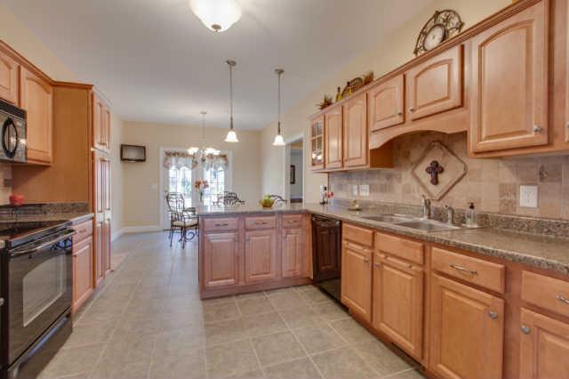 439 Conquest Road Murfreesboro, TN 37128 - Photo 3 of 20 Kitchen has eat-in dinning. The stone backsplash has a square pattern on one wall and subway pattern on the other. There is a wall mounted television with cable outlet in the eat-in. Great for following along with your favorite cooking show.