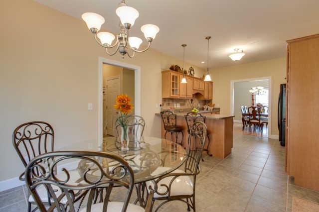 439 Conquest Road Murfreesboro, TN 37128 - Photo 6 of 20 Upgraded, beautiful chandelier in this spacious eat-in kitchen. Double french doors leading out to the patio from eat-in kitchen.