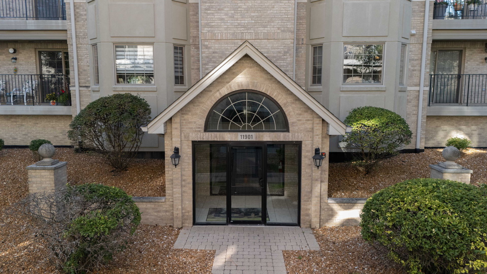 11901 Windemere Court, Unit 301 Orland Park, IL 60467 - Photo 23 of 27 a view of a entrance gate of the house