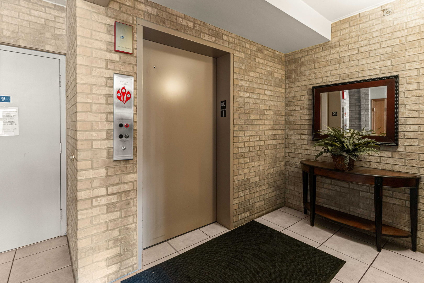 11901 Windemere Court, Unit 301 Orland Park, IL 60467 - Photo 3 of 27 a bathroom with a shower and a sink