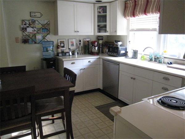 50 Grapevine Road Gloucester, MA 01930 - Photo 6 of 9 a kitchen with a sink cabinets and window