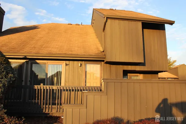 a view of balcony with two windows