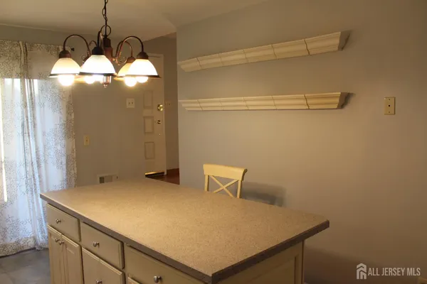 a kitchen with a stove a refrigerator and a sink