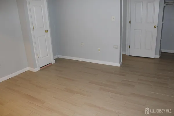 a white toilet sitting next to a white sink
