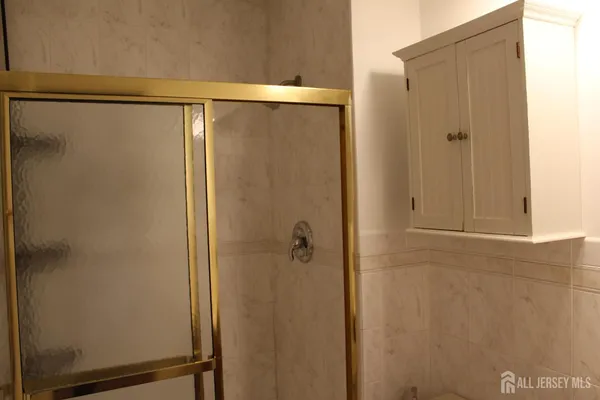 a bathroom with a sink a toilet and bathtub