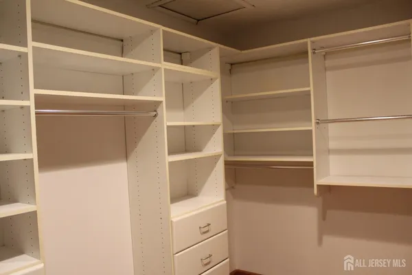 a bathroom with a toilet and a shower curtain