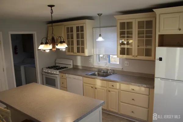 a view of an entryway with wooden floor and door