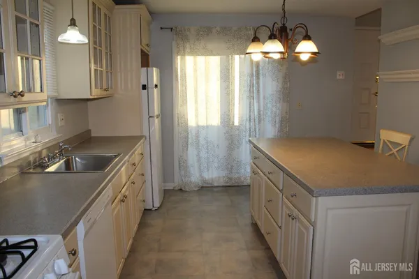 a room with closet and chandelier