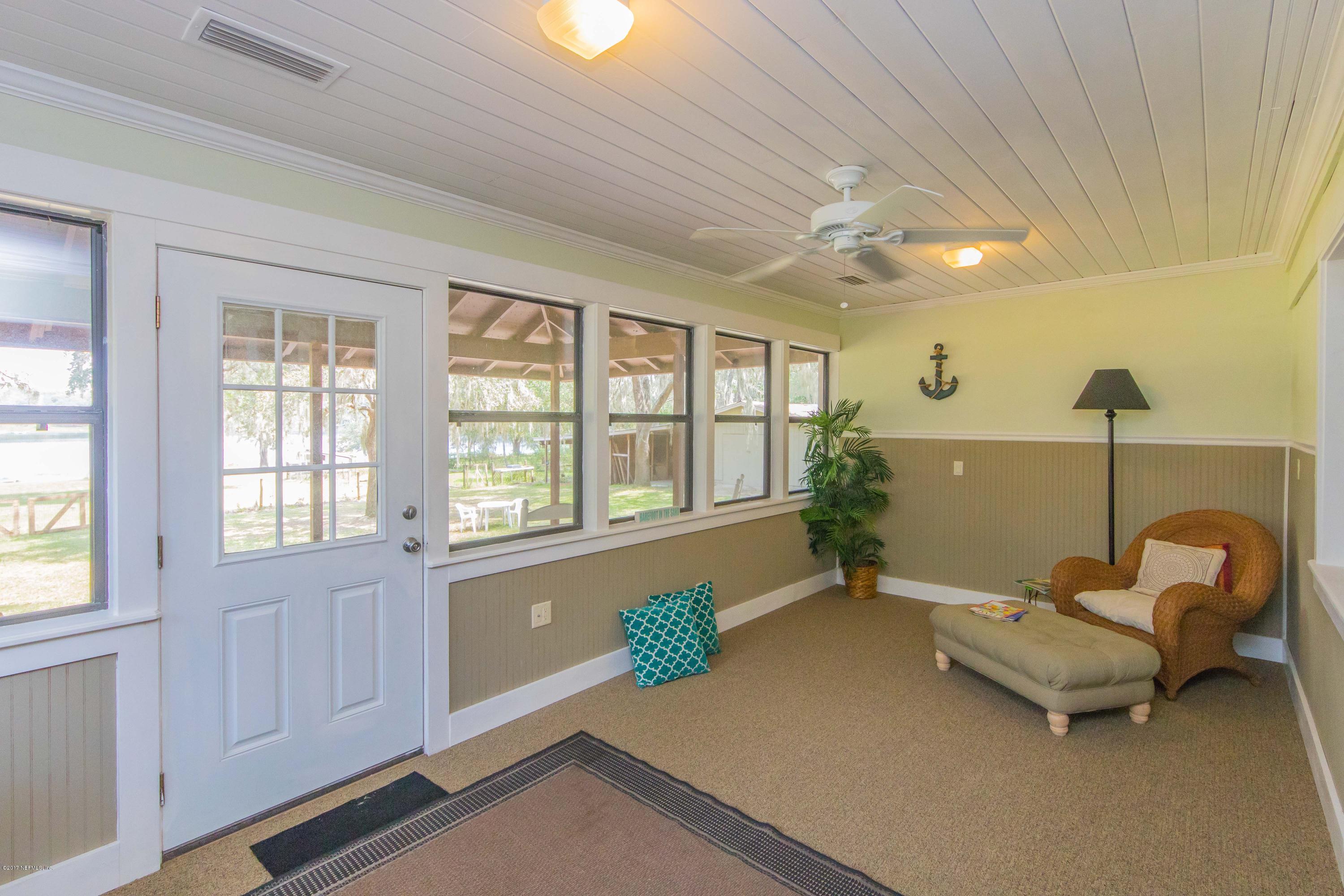 6255 Little Lake Geneva Road Keystone Heights, FL 32656 - Photo 21 of 59 a living room with furniture and windows