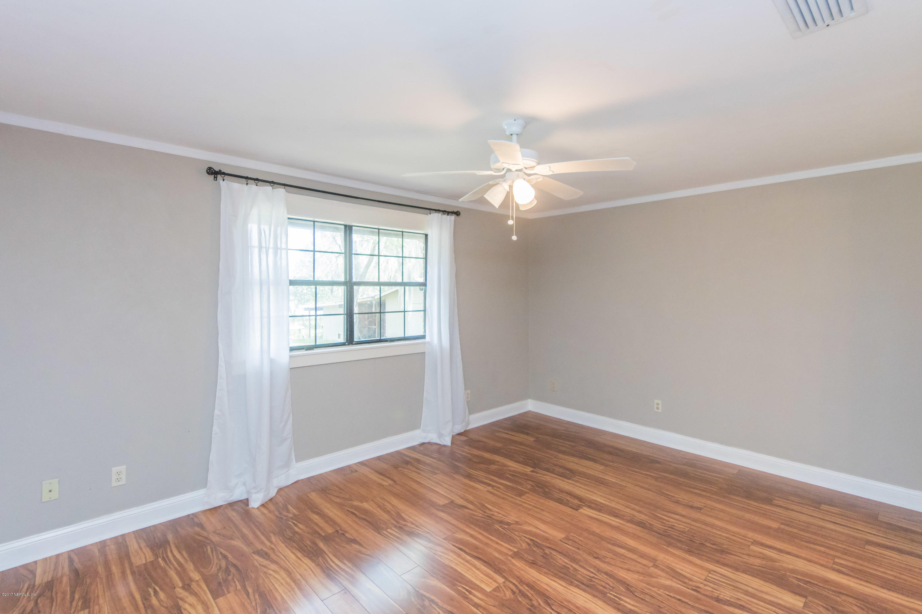 6255 Little Lake Geneva Road Keystone Heights, FL 32656 - Photo 24 of 59 wooden floor in an empty room with a window