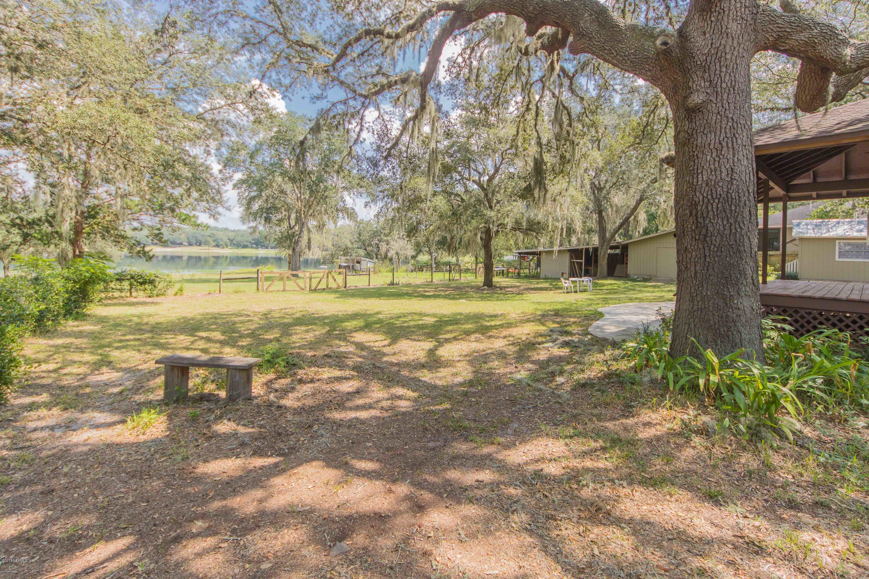 6255 Little Lake Geneva Road Keystone Heights, FL 32656 - Photo 40 of 59 a view of a yard with an trees