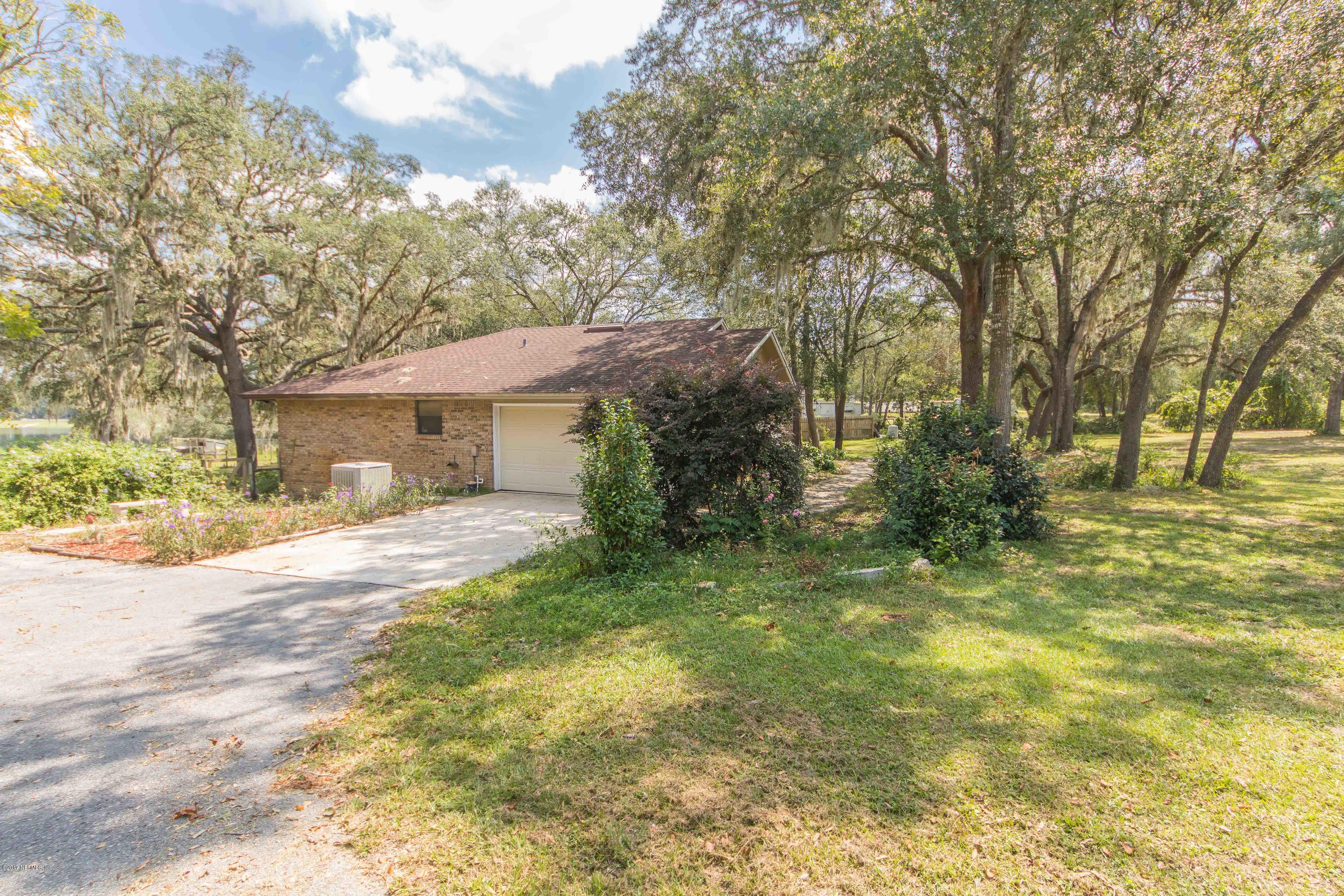 6255 Little Lake Geneva Road Keystone Heights, FL 32656 - Photo 4 of 59 a view of a house with a yard