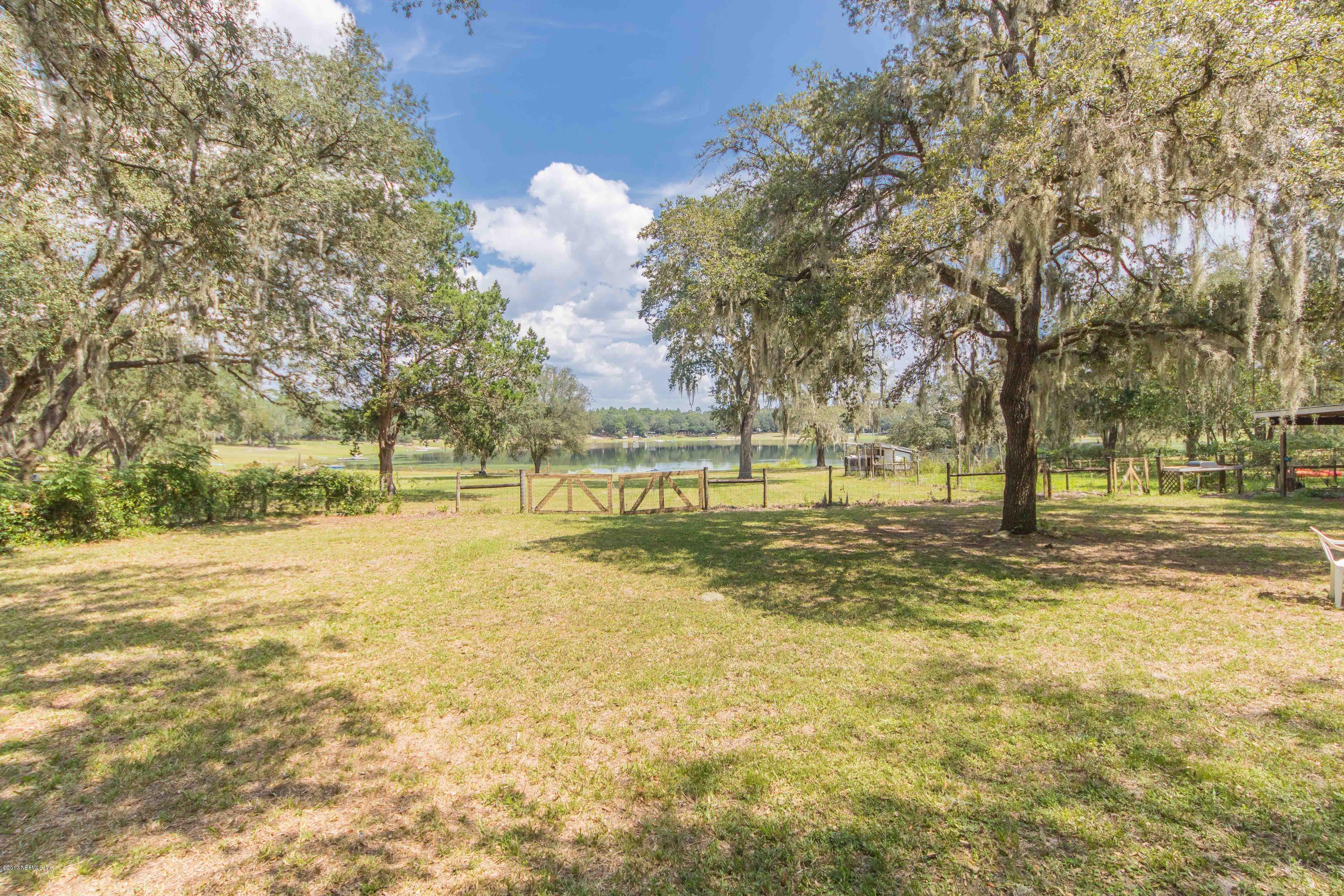 6255 Little Lake Geneva Road Keystone Heights, FL 32656 - Photo 41 of 59 a view of a yard with a large trees