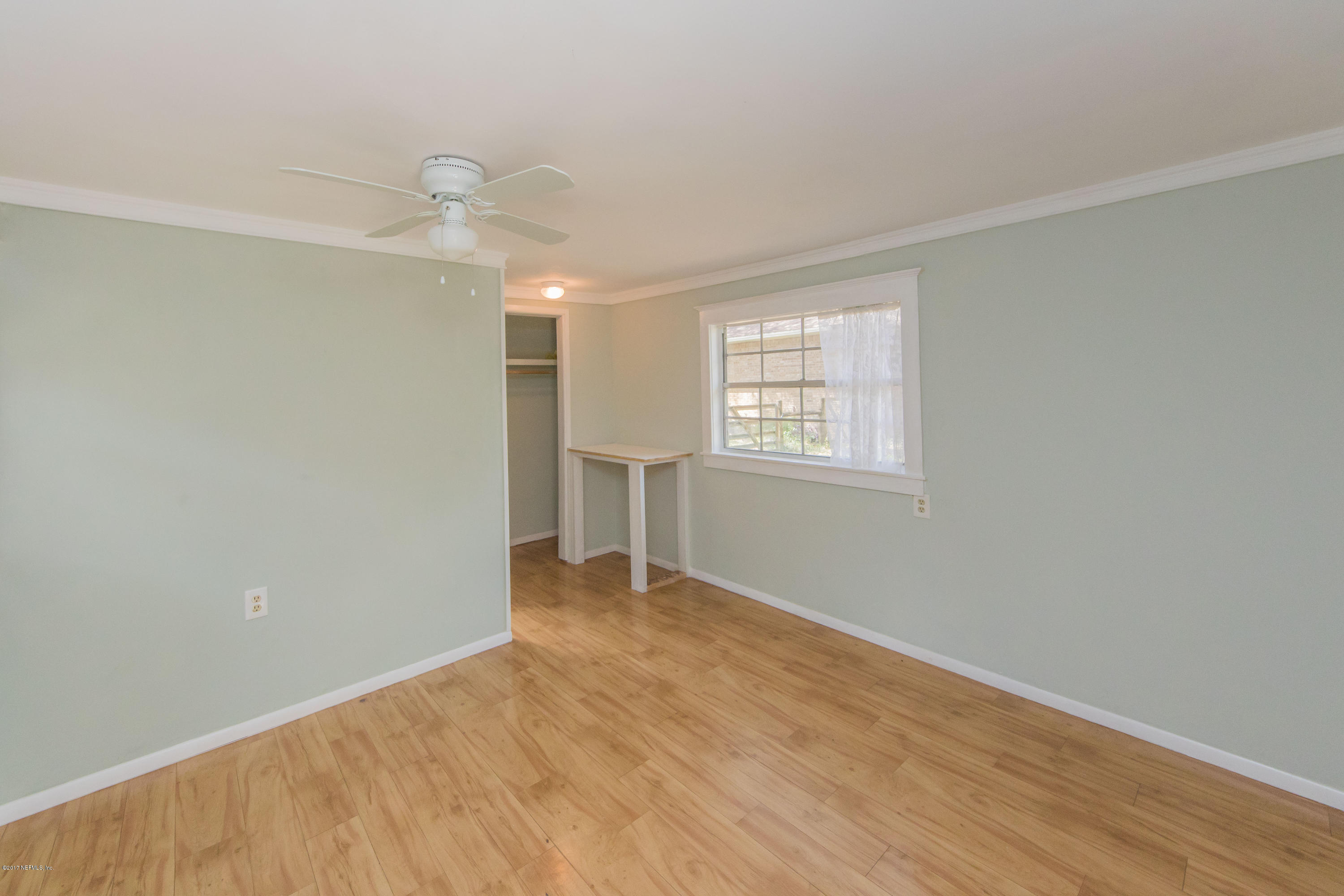 6255 Little Lake Geneva Road Keystone Heights, FL 32656 - Photo 54 of 59 wooden floor in an empty room with a window