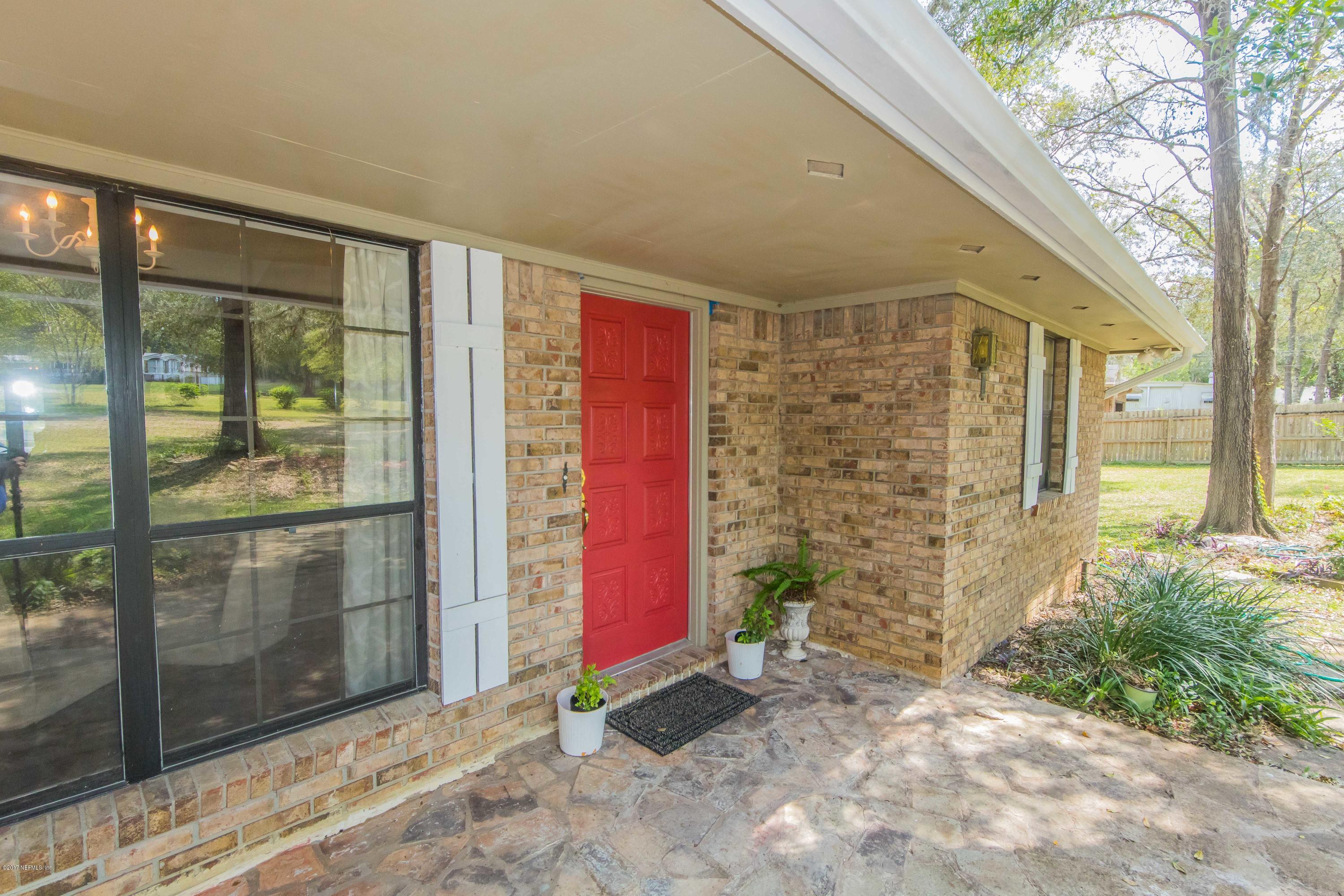 6255 Little Lake Geneva Road Keystone Heights, FL 32656 - Photo 6 of 59 a front view of a house with a yard