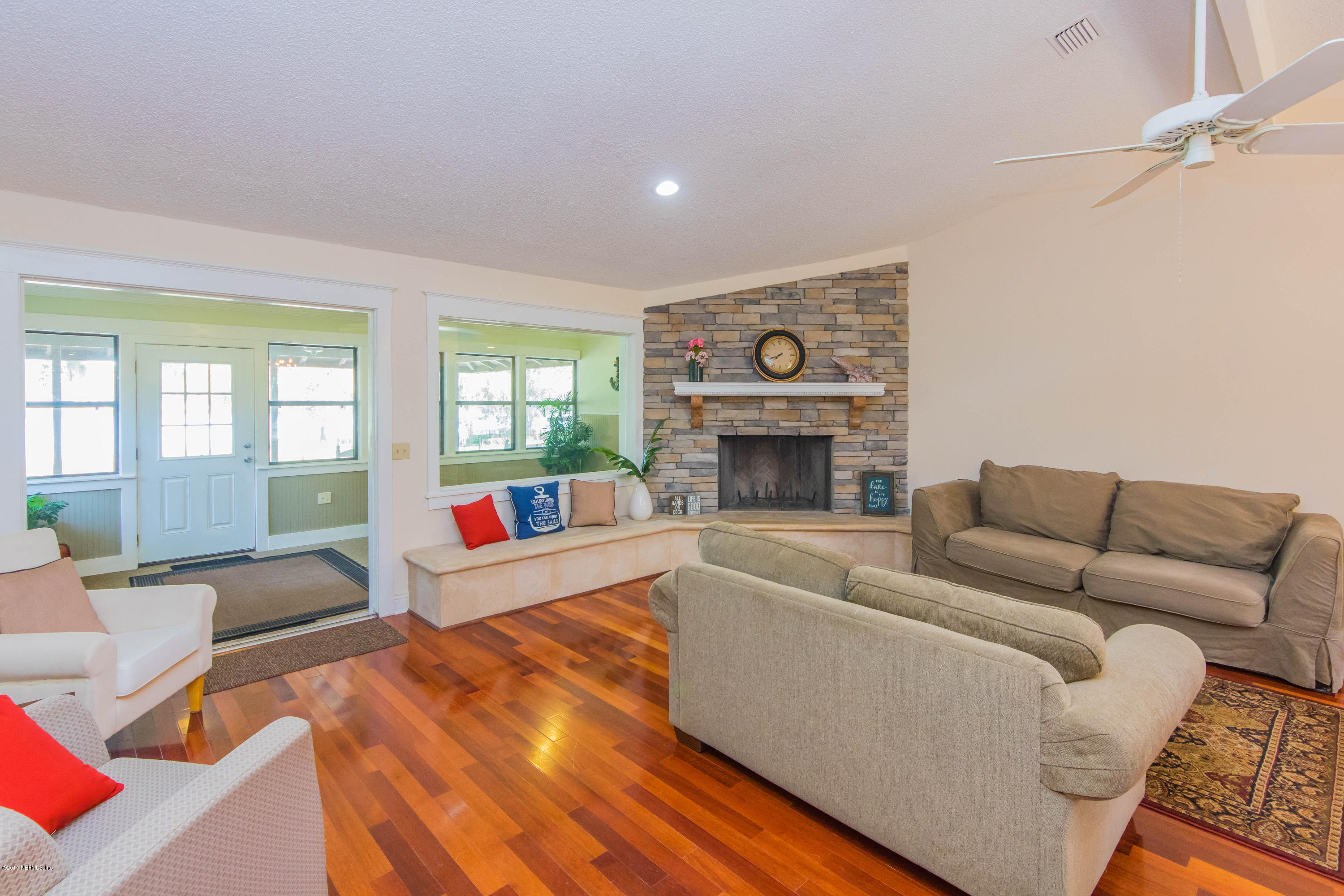 6255 Little Lake Geneva Road Keystone Heights, FL 32656 - Photo 10 of 59 a living room with furniture and a fireplace