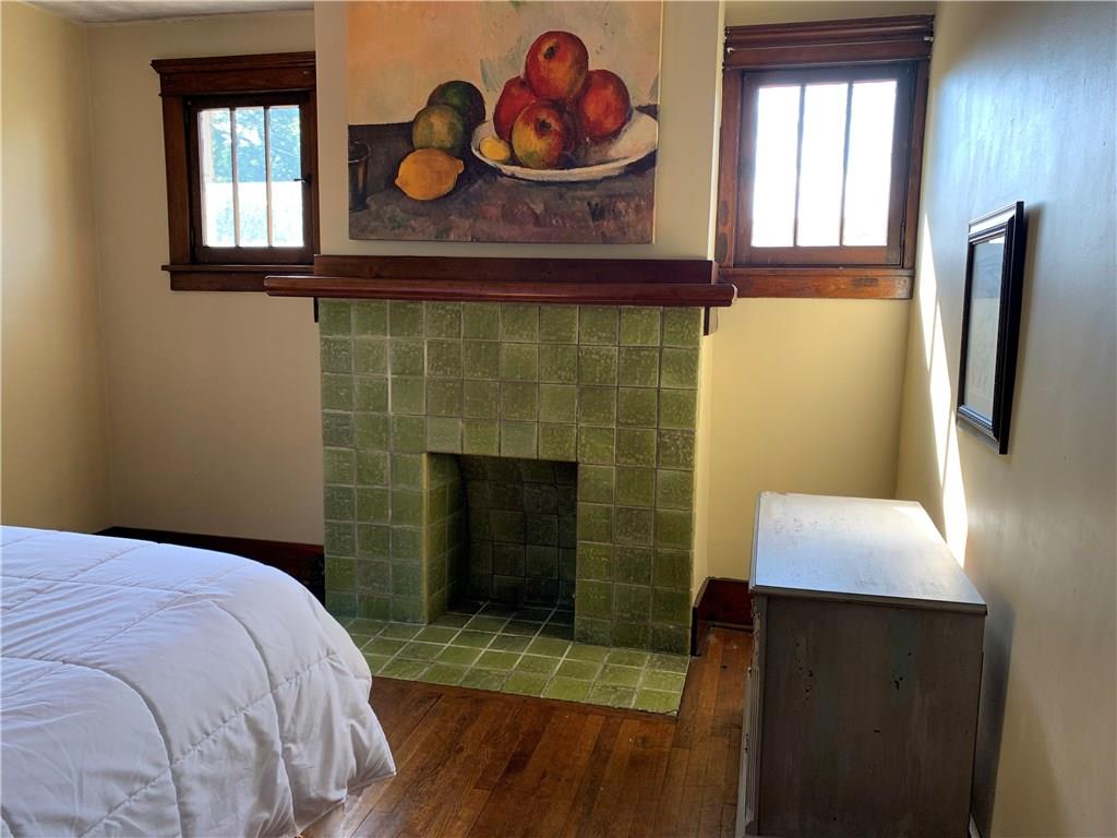 2619 Brighton Road Pittsburgh, PA 15212 - Photo 14 of 23 Original ceramic tile fireplace at larger front bedroom 13x12.