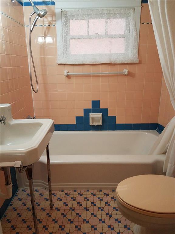 2619 Brighton Road Pittsburgh, PA 15212 - Photo 20 of 23 Main Floor Full Bath with vintage ceramic tile walls and floor.