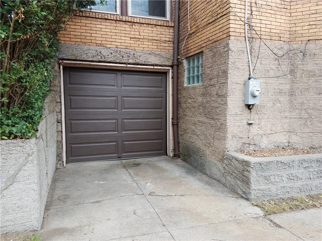 2619 Brighton Road Pittsburgh, PA 15212 - Photo 21 of 23 New garage door with automatic opener, new glass block window and electric meter.