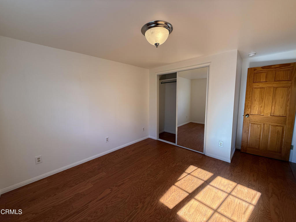 1775 Atchison Street Pasadena, CA 91104 - Photo 12 of 21 a view of empty room with wooden floor and fan