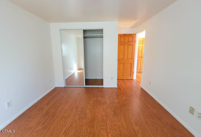 1775 Atchison Street Pasadena, CA 91104 - Photo 15 of 21 a view of an empty room with wooden floor and a window