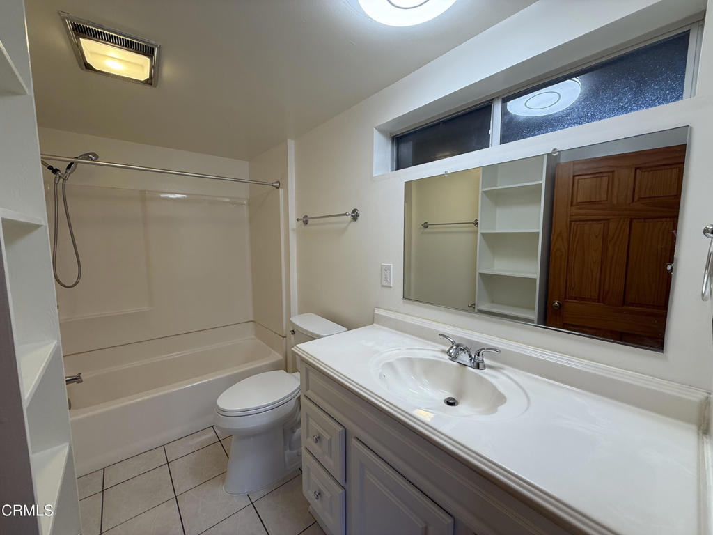 1775 Atchison Street Pasadena, CA 91104 - Photo 15 of 18 a bathroom with a sink a toilet and shower