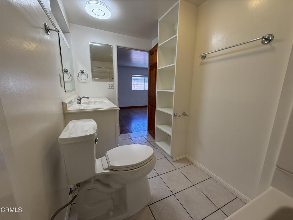 1775 Atchison Street Pasadena, CA 91104 - Photo 18 of 18 a bathroom with a sink toilet and shower