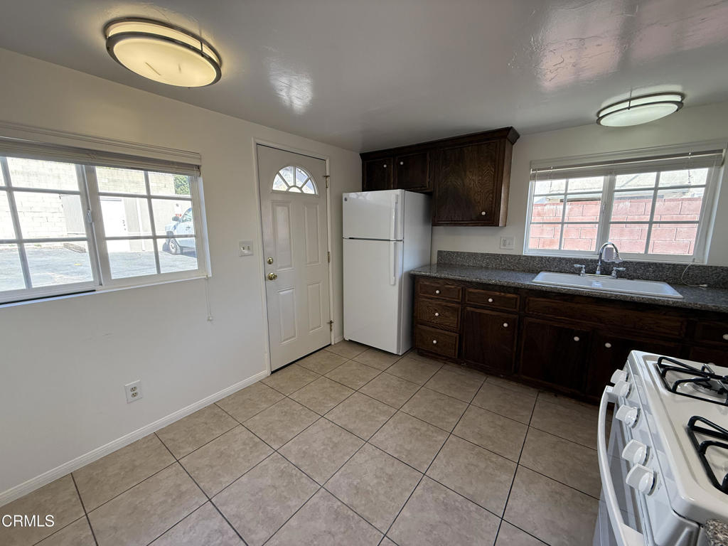 1775 Atchison Street Pasadena, CA 91104 - Photo 7 of 18 a kitchen with a sink and cabinets