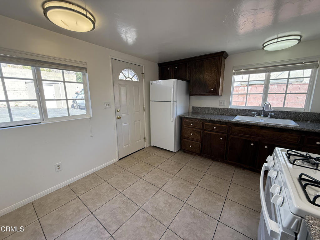 1775 Atchison Street Pasadena, CA 91104 - Photo 9 of 21 a kitchen with a sink and cabinets