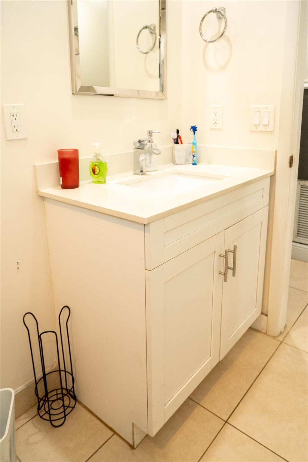 2710 Northwest 5th Street Pompano Beach, FL 33069 - Photo 15 of 31 a bathroom with a sink and a mirror