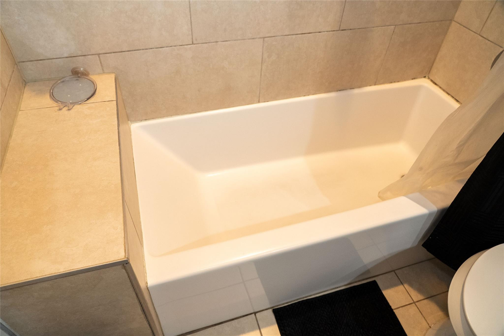 2710 Northwest 5th Street Pompano Beach, FL 33069 - Photo 26 of 31 a view of a bathtub in a bathroom