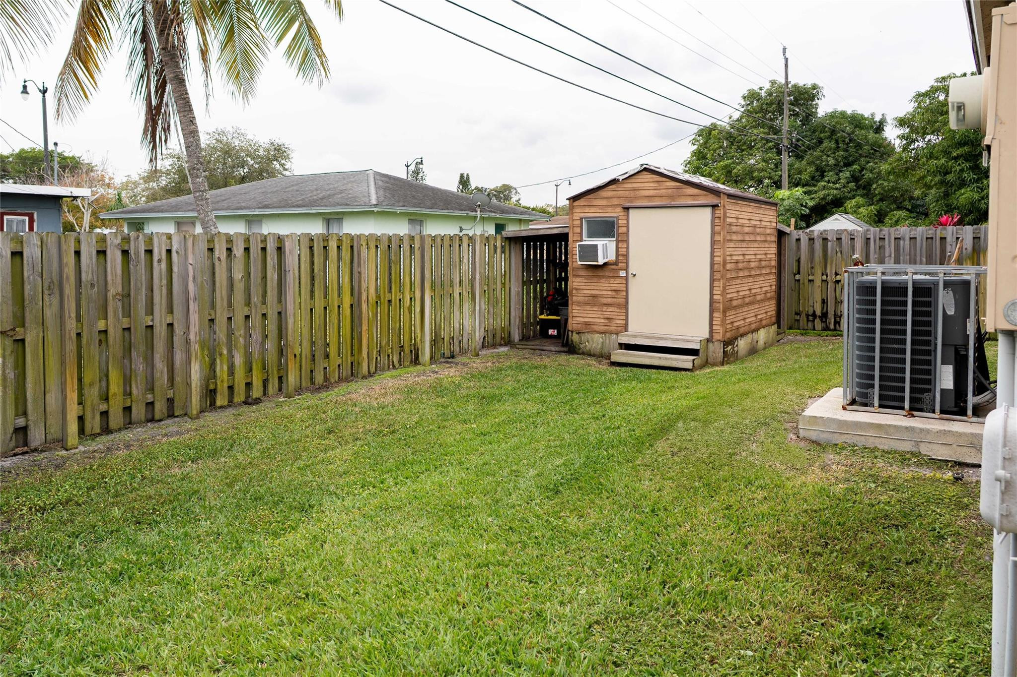 2710 Northwest 5th Street Pompano Beach, FL 33069 - Photo 29 of 31 a view of a house with a yard and plants