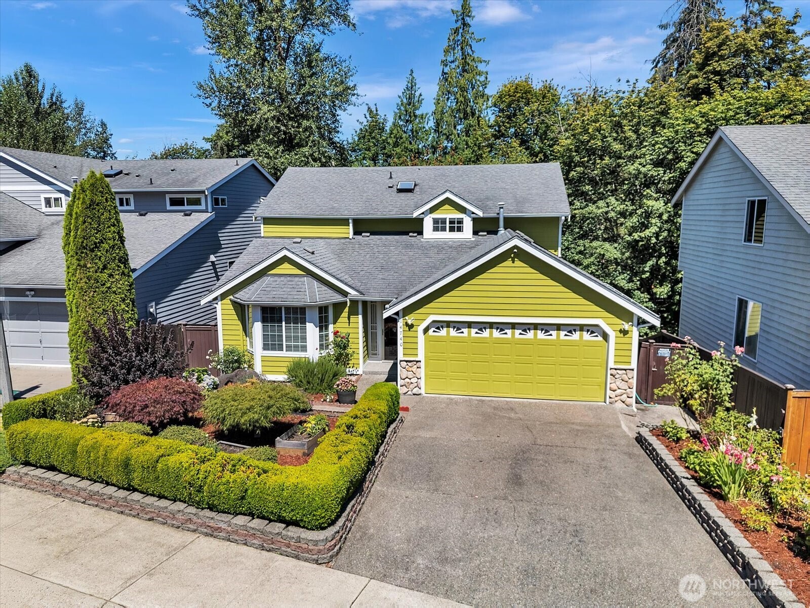 14740 Southeast 187 Court Renton, WA 98058 - Photo 2 of 38 a view of a house with a yard and potted plants