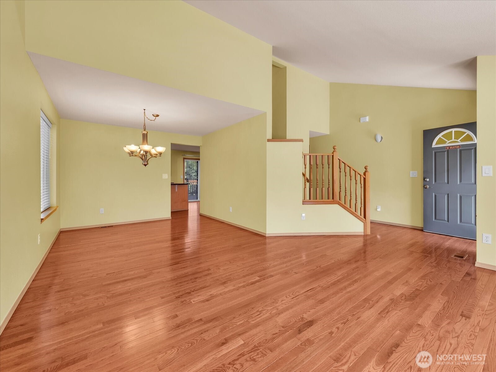 14740 Southeast 187 Court Renton, WA 98058 - Photo 7 of 38 a view of an empty room with wooden floor and staircase