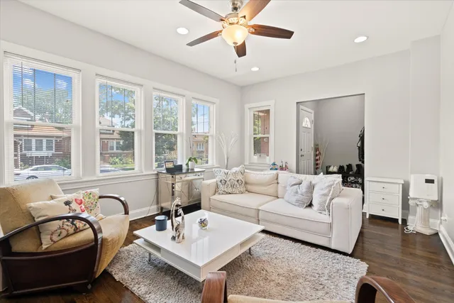 a living room with furniture and windows