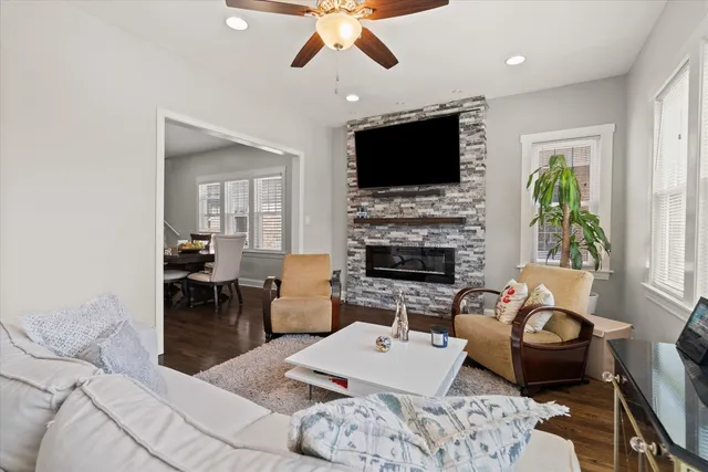 a living room with furniture fireplace and a flat screen tv