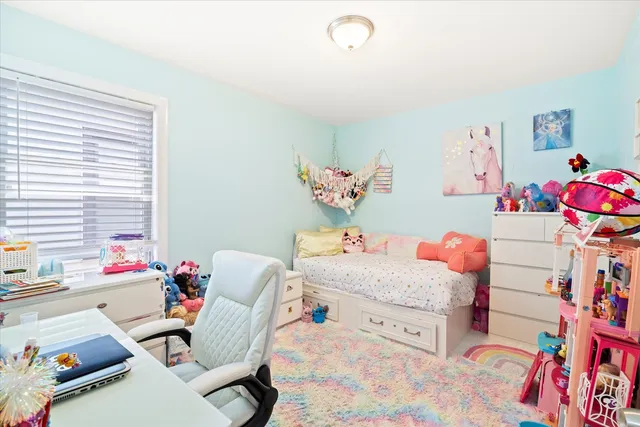 a bedroom with furniture and a bed