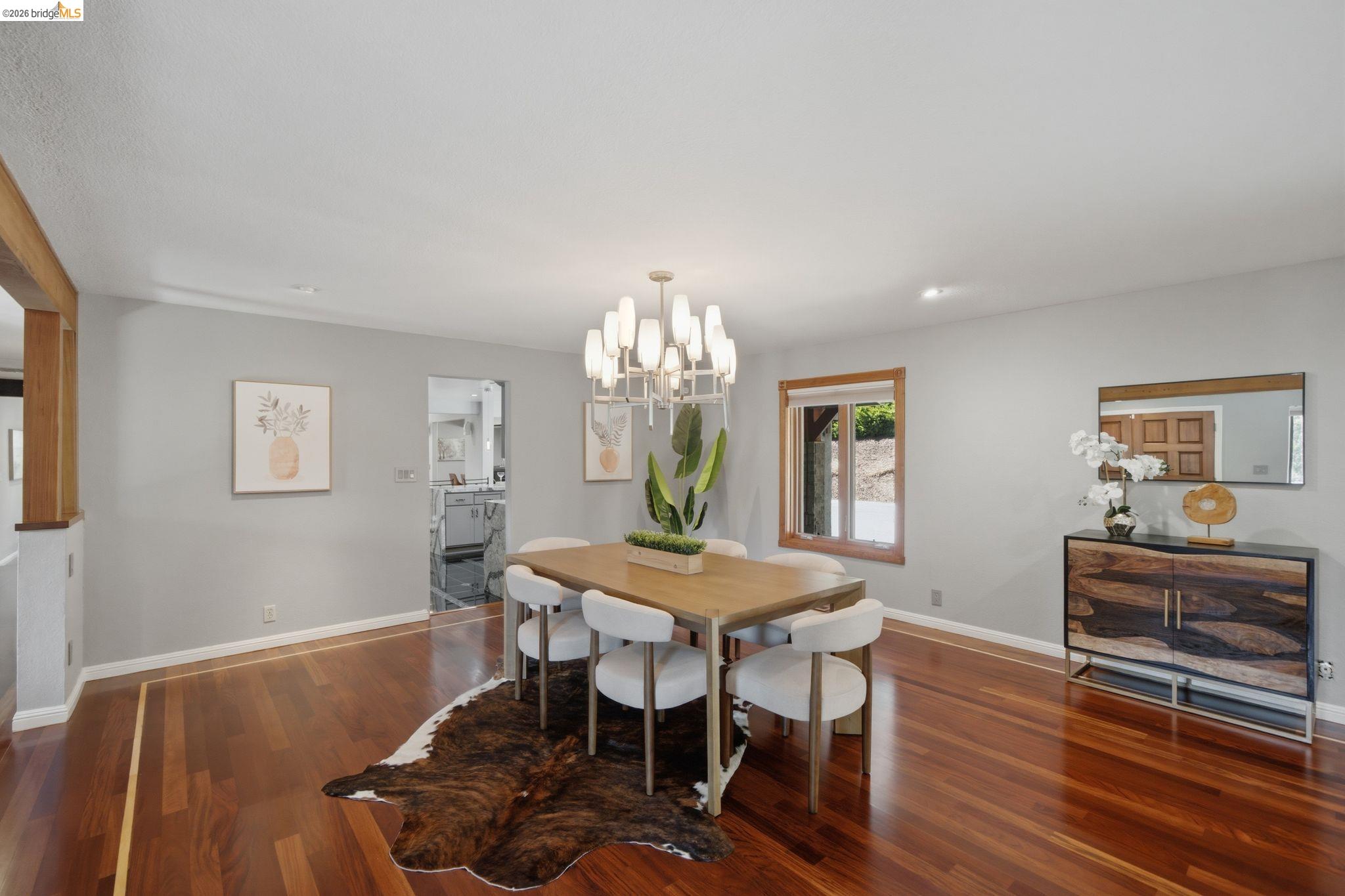 11133 Golf Links Road Oakland, CA 94605 - Photo 12 of 57 Spacious dining area featuring rich hardwood flooring with a distinct border inlay