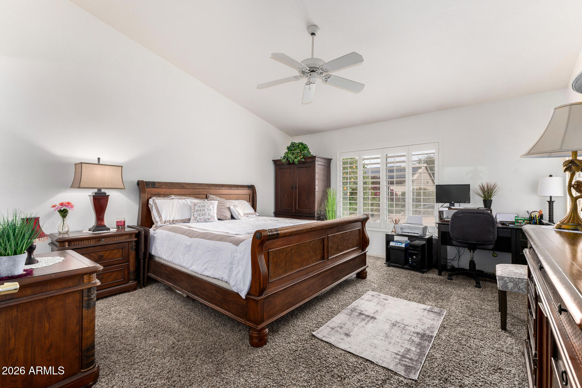 15764 Piccadilly Road Goodyear, AZ 85395 - Photo 15 of 31 a bed room with a bed and a chair