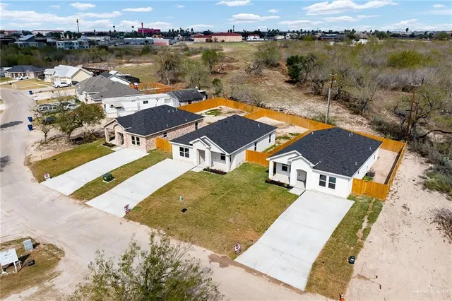 an aerial view of a house with lake view