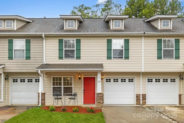 a view of a city with lush green forest