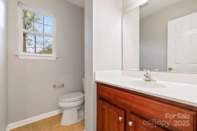 a bedroom with a bed and a chair