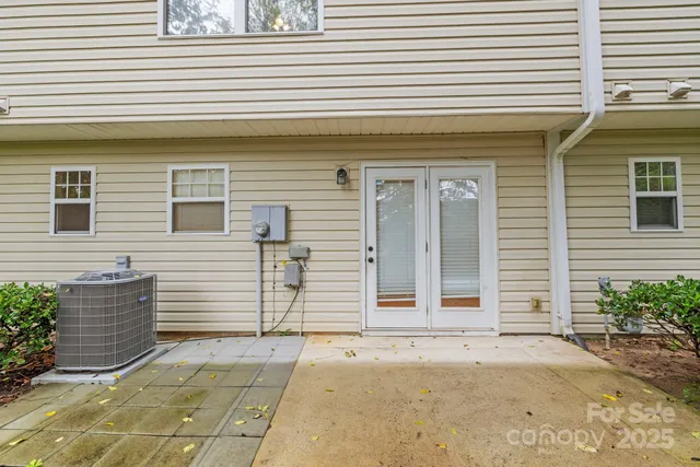 a view of backyard with plants and trees