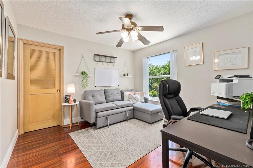 18770 Southeast River Ridge Road Jupiter, FL 33469 - Photo 41 of 81 a living room with furniture and a chandelier