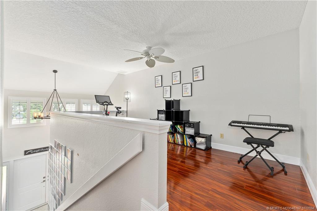 18770 Southeast River Ridge Road Jupiter, FL 33469 - Photo 52 of 81 a living room with furniture and a wooden floor