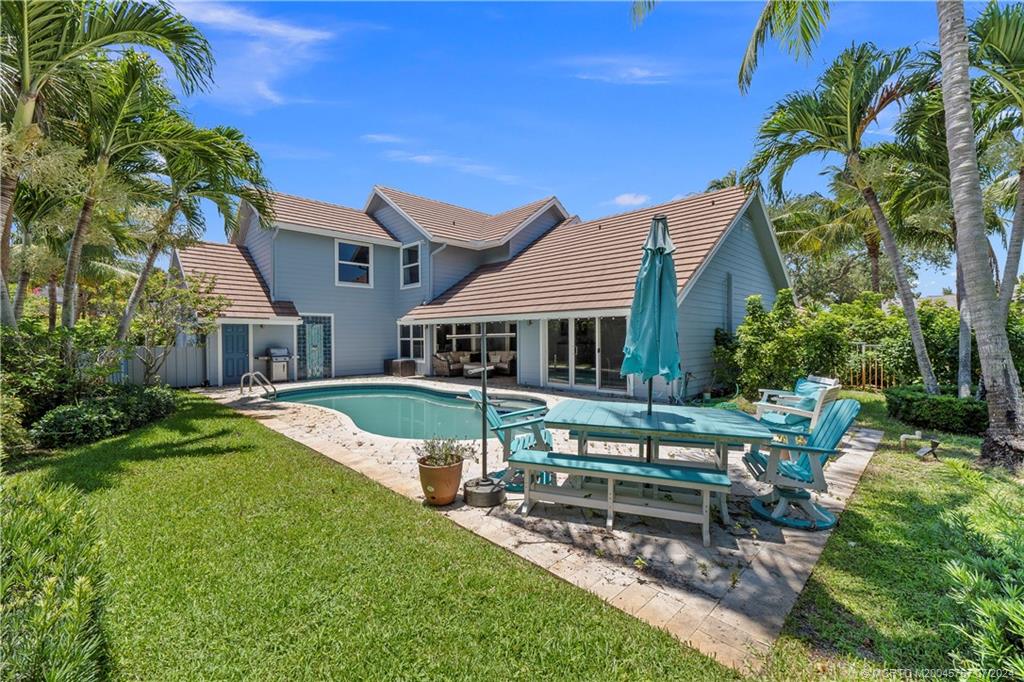 18770 Southeast River Ridge Road Jupiter, FL 33469 - Photo 59 of 81 a view of house with a yard